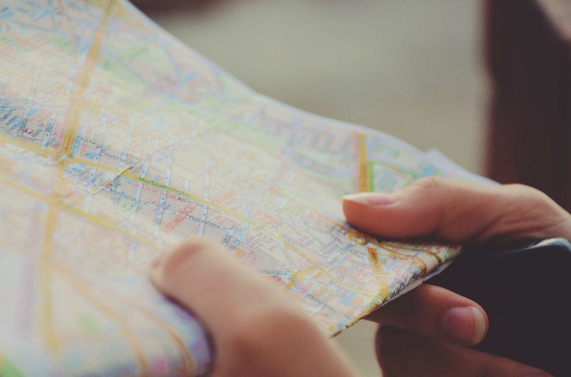 person holding travel map
